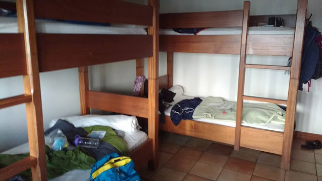 Wooden bunk beds in a hostel