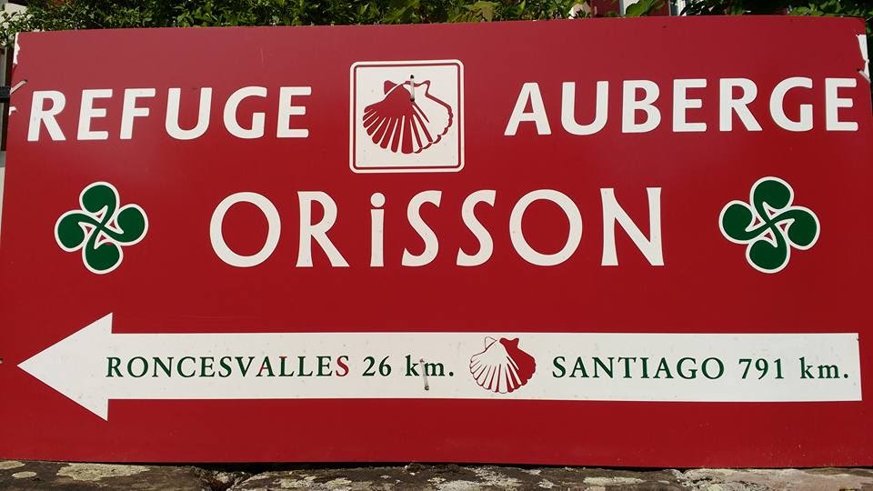 Sign that says Refuge Orisson with kilometre marker to Roncesvalles and Santiago