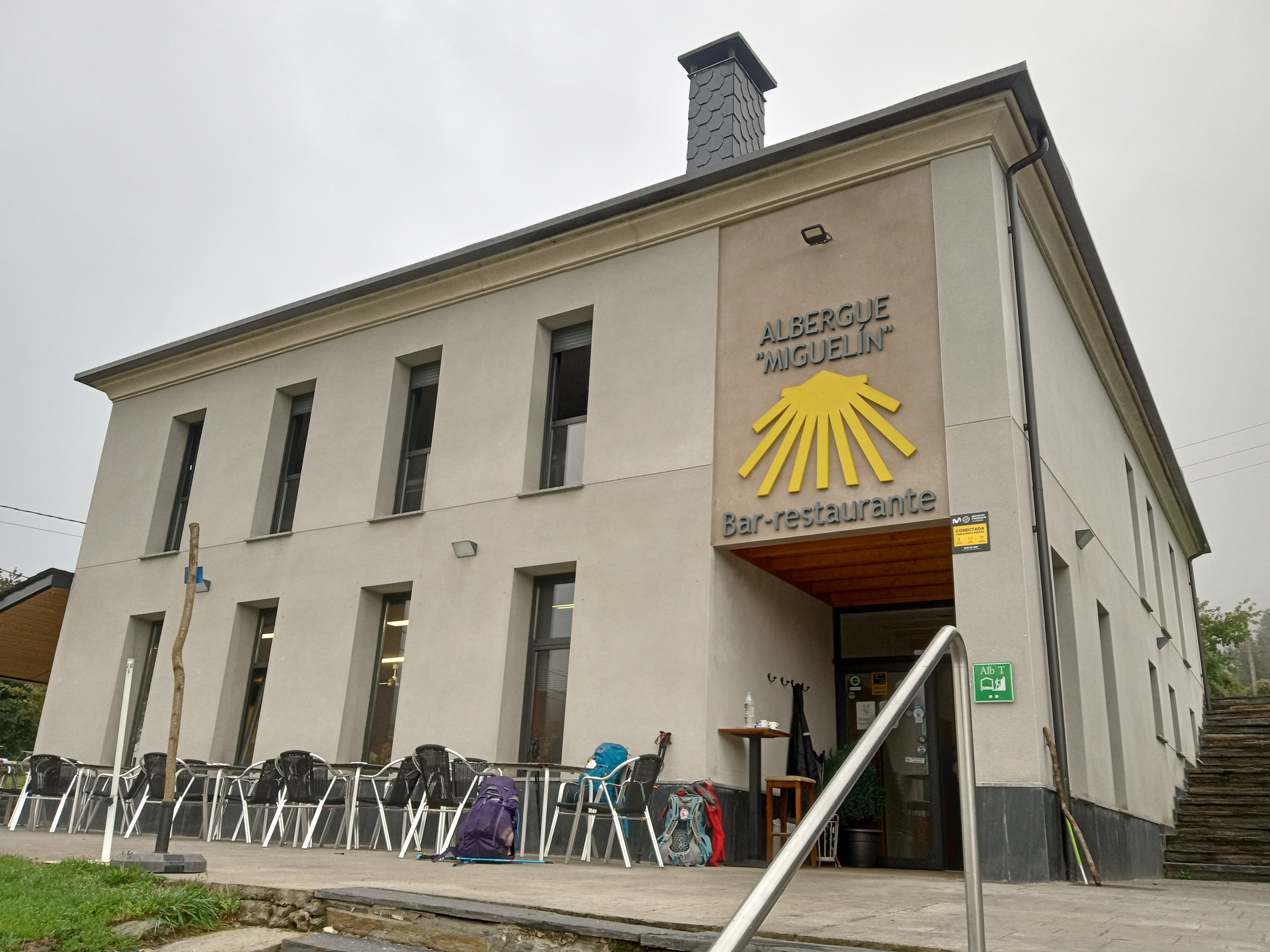 An albergue with a Camino shell in front